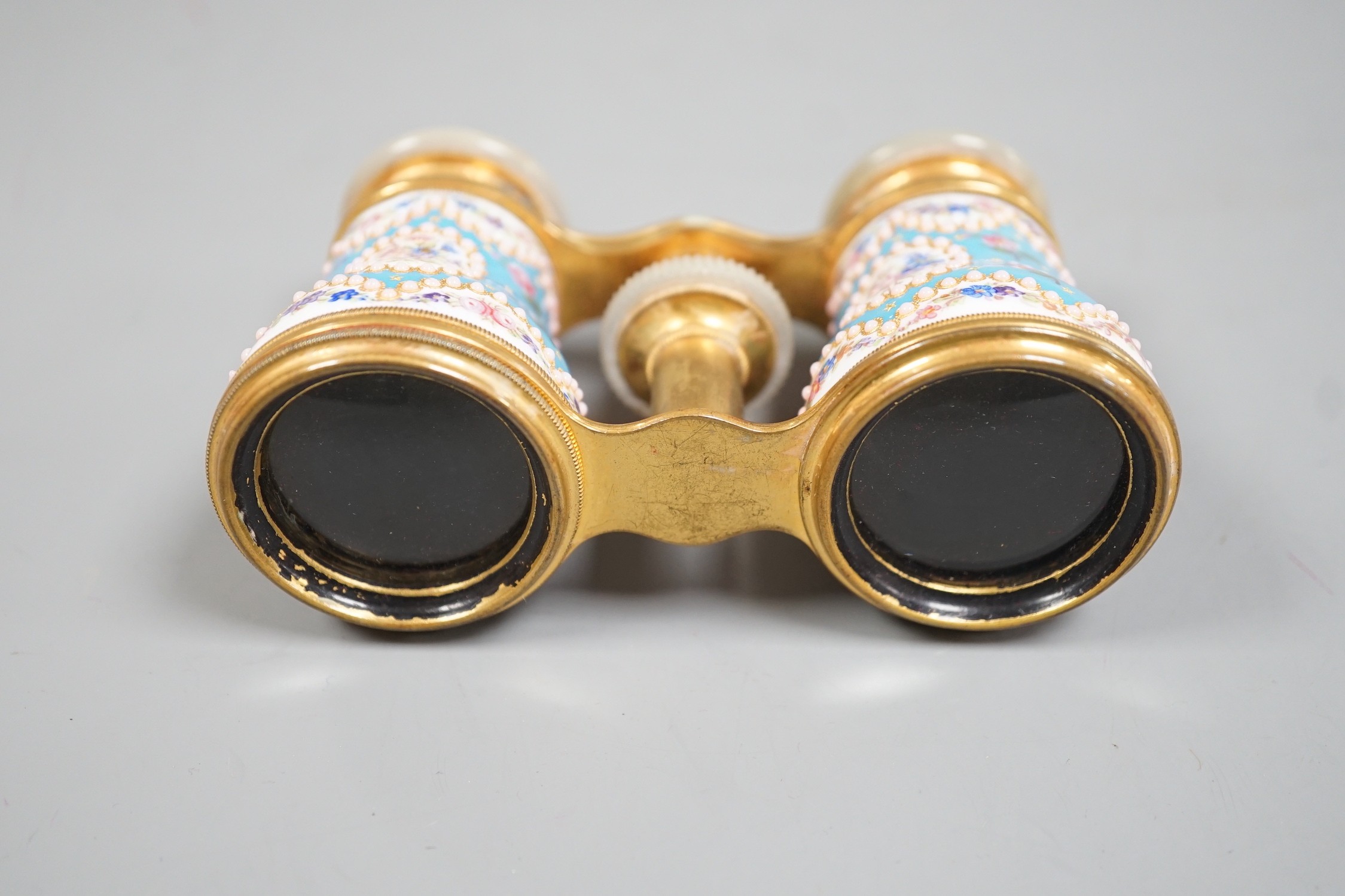 A pair of French enamel, brass and mother of pearl opera glasses, signed ‘Le Maire Paris’, in original fitted case